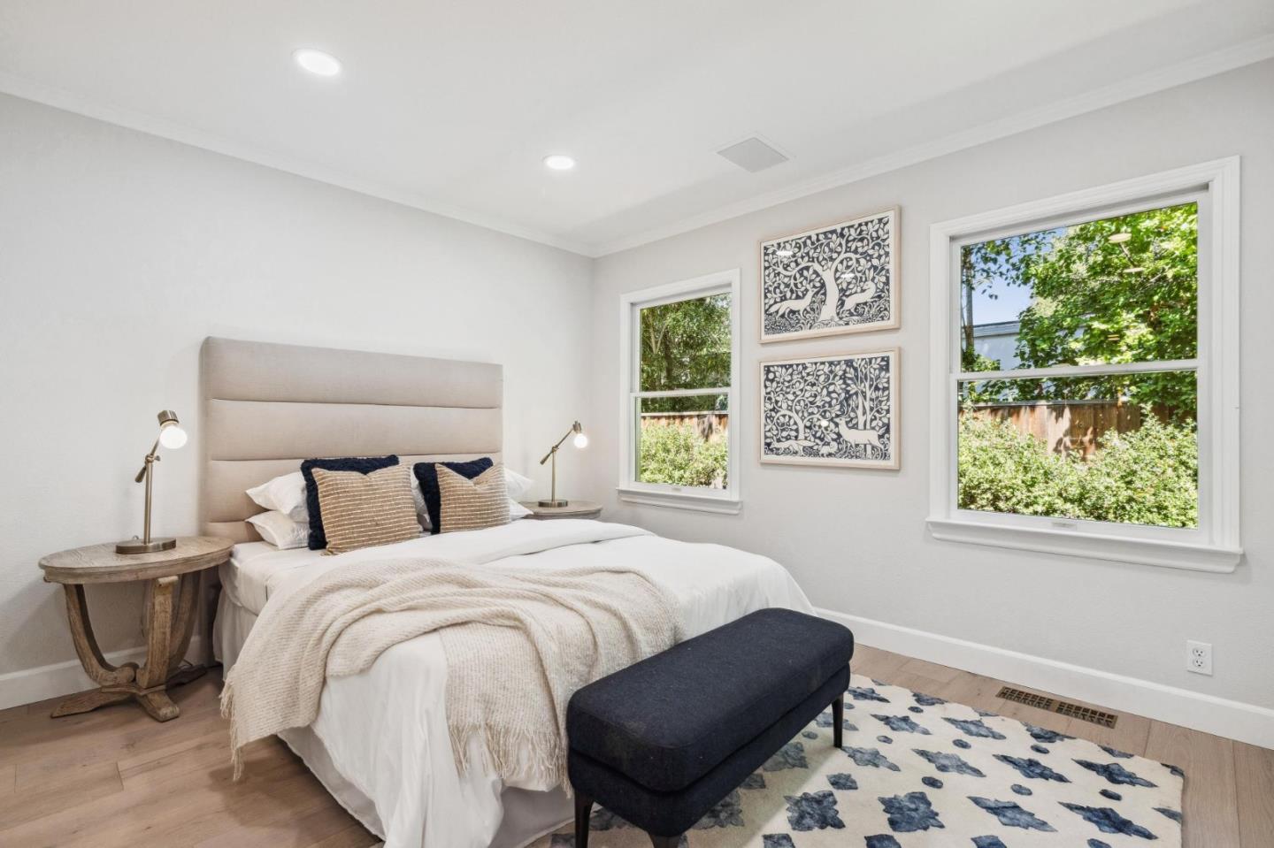961 Berkeley Avenue Menlo Park, CA 94025 - Photo 16 of 27 a bedroom with a bed and a lamp on dresser