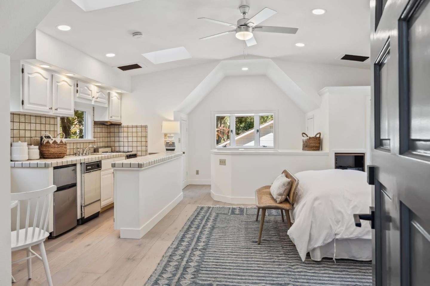 961 Berkeley Avenue Menlo Park, CA 94025 - Photo 22 of 27 a kitchen with white cabinets and white appliances