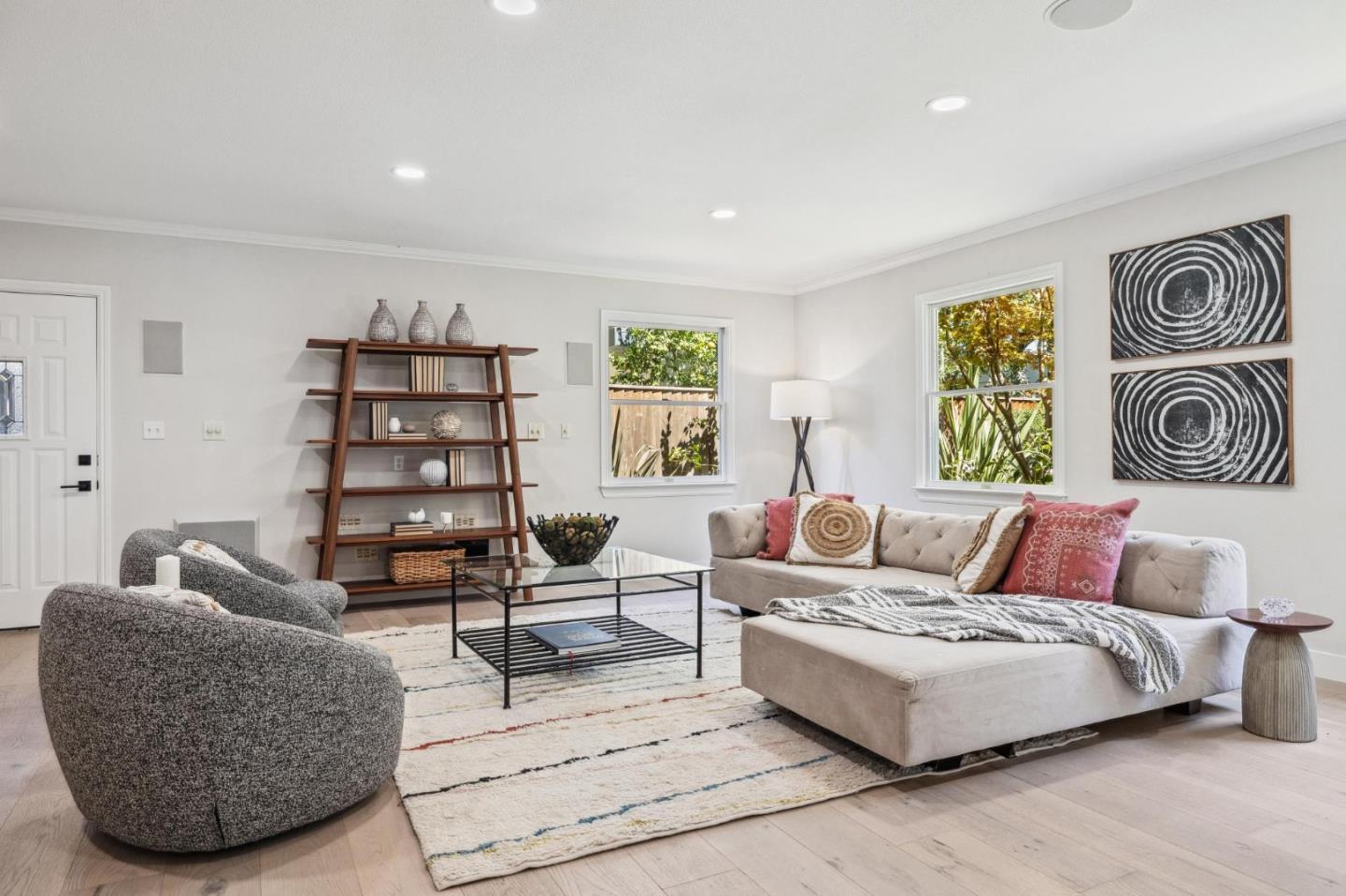 961 Berkeley Avenue Menlo Park, CA 94025 - Photo 25 of 27 a spacious bedroom with a bed a couch and painting on the wall