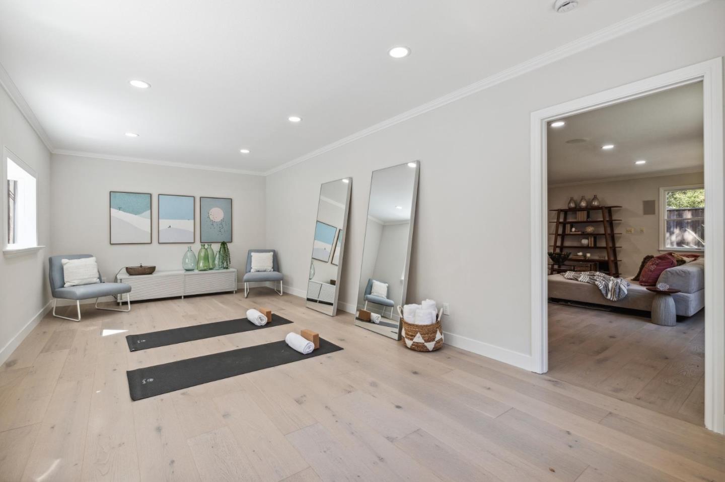 961 Berkeley Avenue Menlo Park, CA 94025 - Photo 26 of 27 a living room with furniture gym equipment and a large window