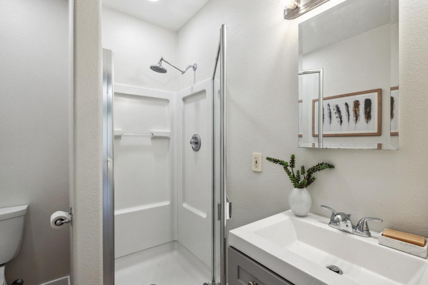 961 Berkeley Avenue Menlo Park, CA 94025 - Photo 27 of 27 a bathroom with a sink and a mirror