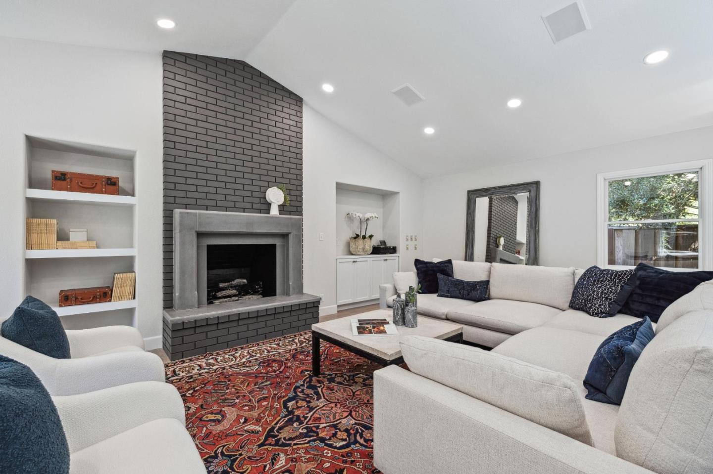 961 Berkeley Avenue Menlo Park, CA 94025 - Photo 10 of 27 a living room with furniture and a fireplace
