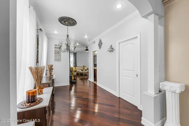 a kitchen with stainless steel appliances granite countertop a stove top oven a refrigerator a sink and a center island