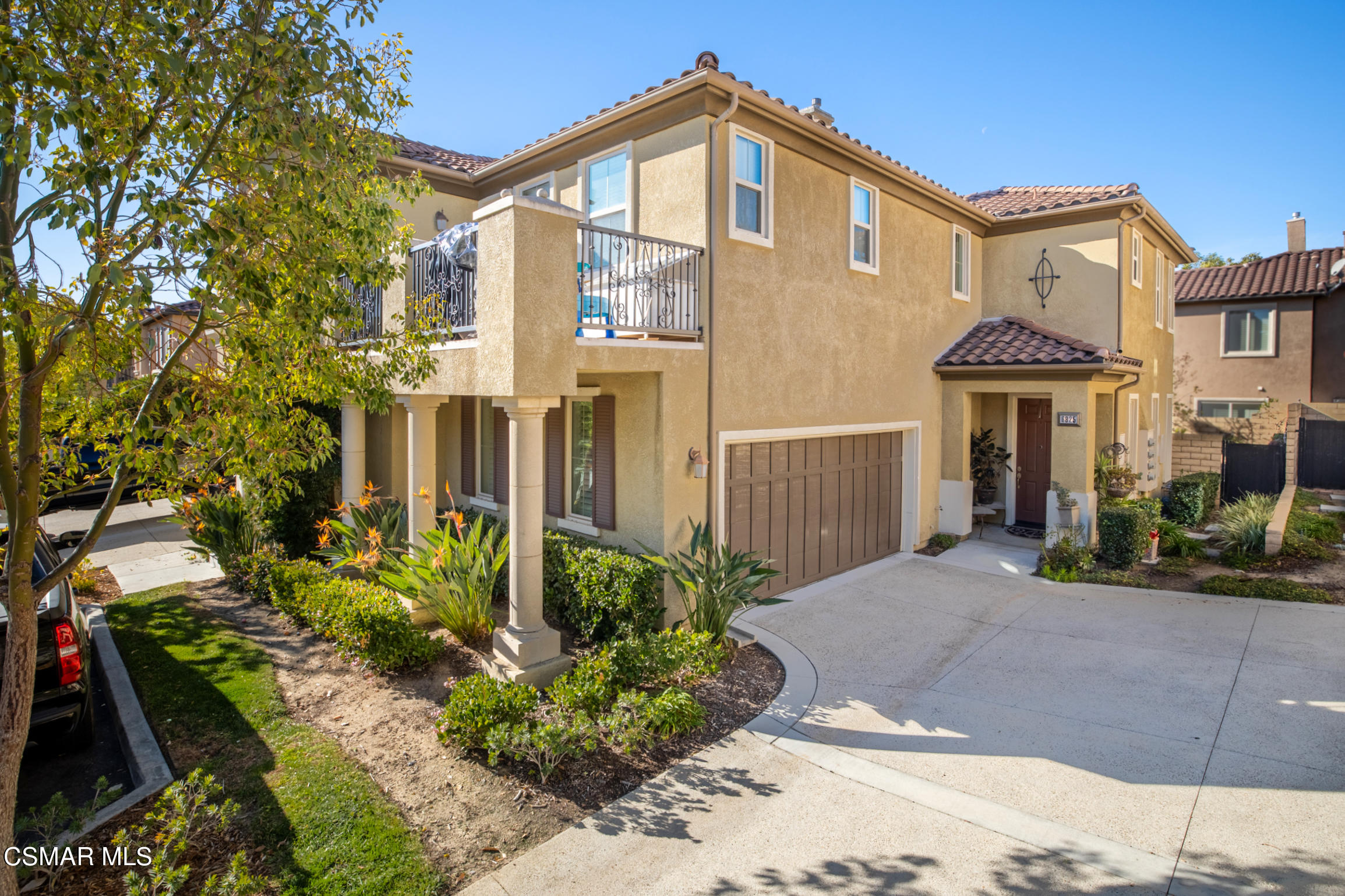 a front view of a house with garden