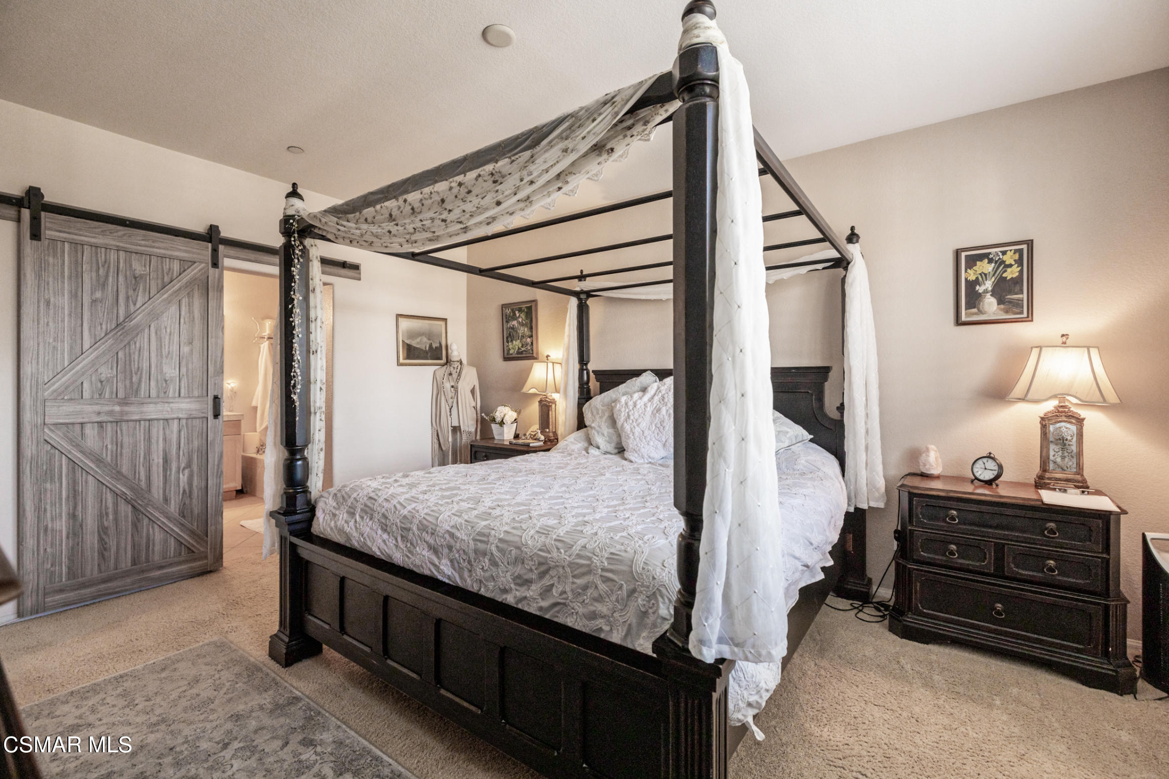 6825 Simmons Way Moorpark, CA 93021 - Photo 11 of 24 a bedroom with a bed and a dresser