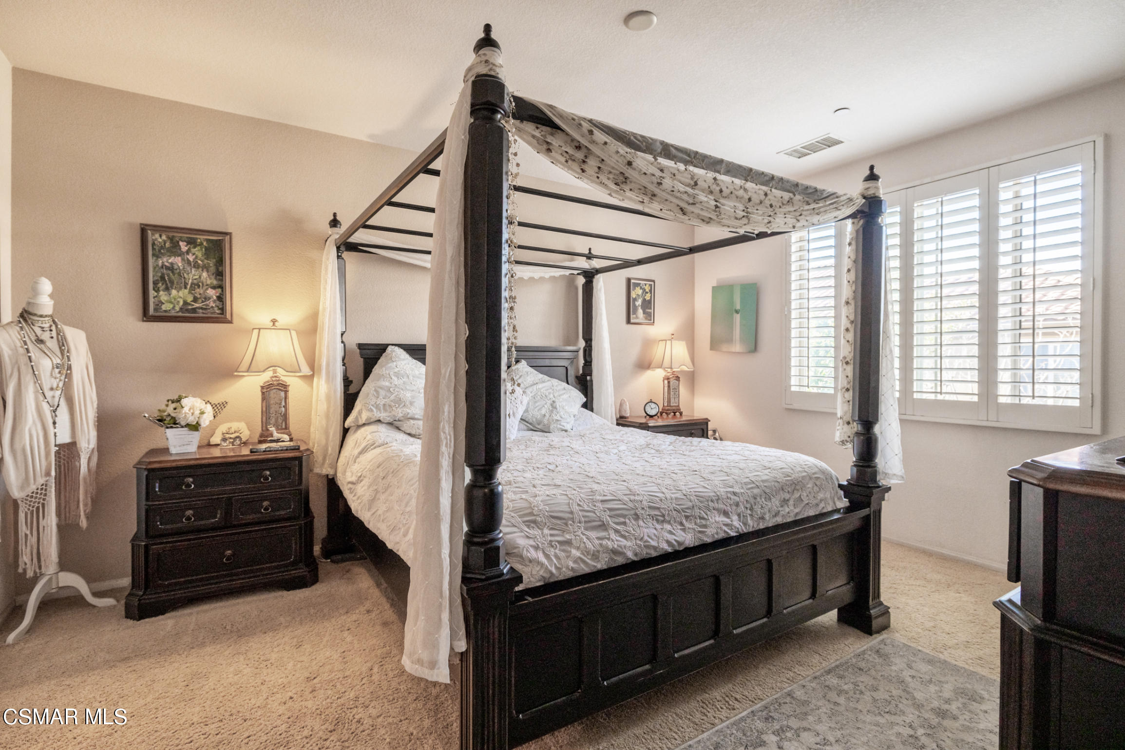 6825 Simmons Way Moorpark, CA 93021 - Photo 12 of 24 a bedroom with bed and a window