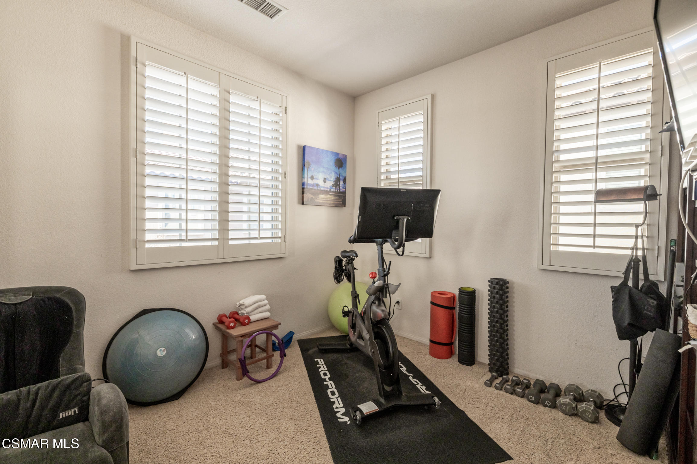6825 Simmons Way Moorpark, CA 93021 - Photo 14 of 24 a room with gym equipment and a window