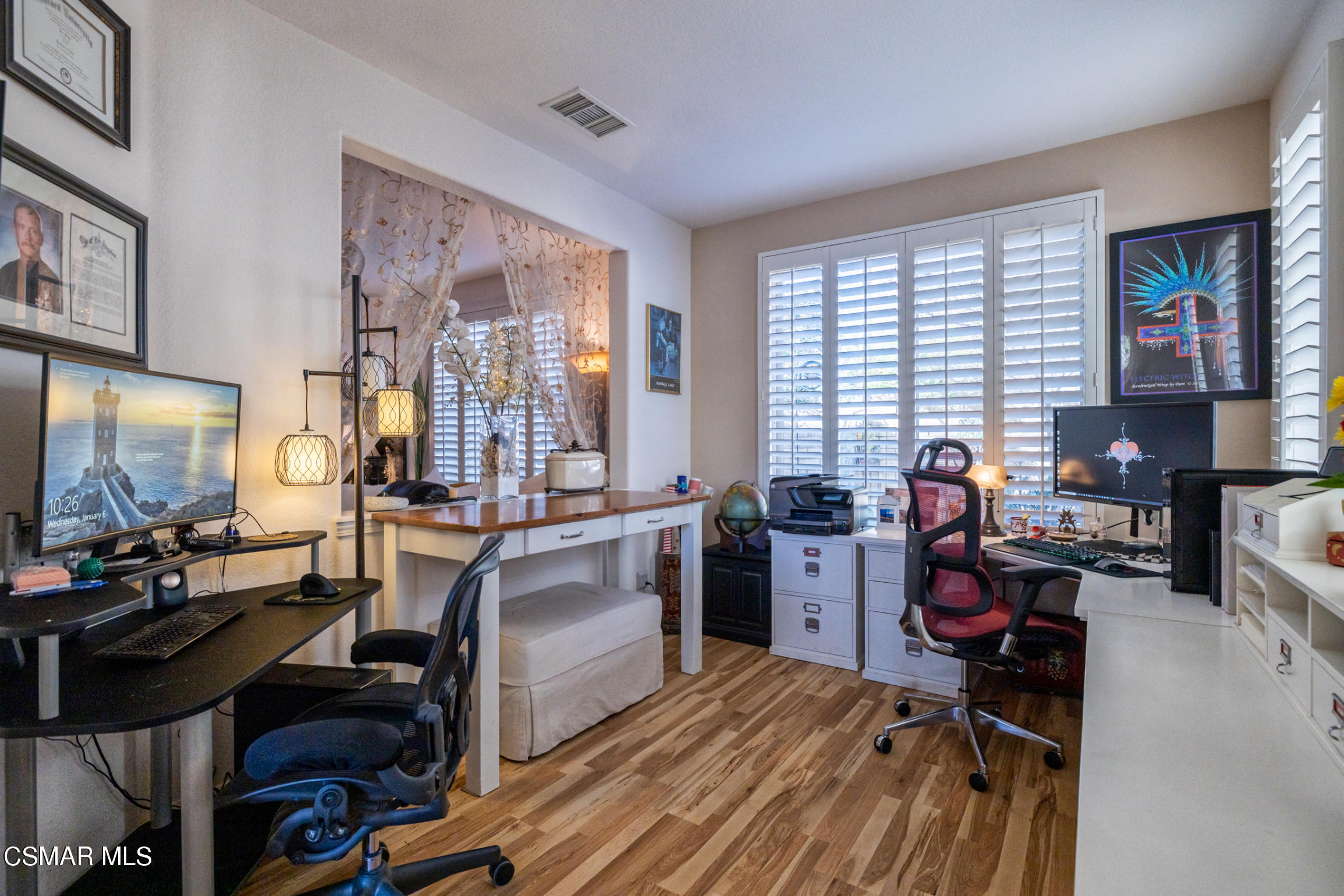 6825 Simmons Way Moorpark, CA 93021 - Photo 3 of 24 a living room with furniture and a flat screen tv