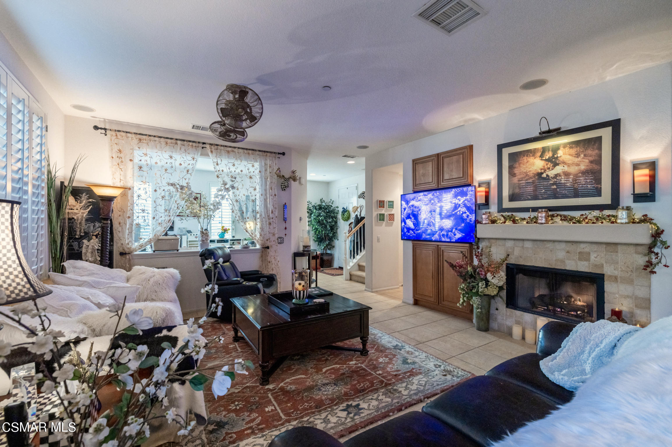 6825 Simmons Way Moorpark, CA 93021 - Photo 5 of 24 a living room with furniture fireplace and flat screen tv