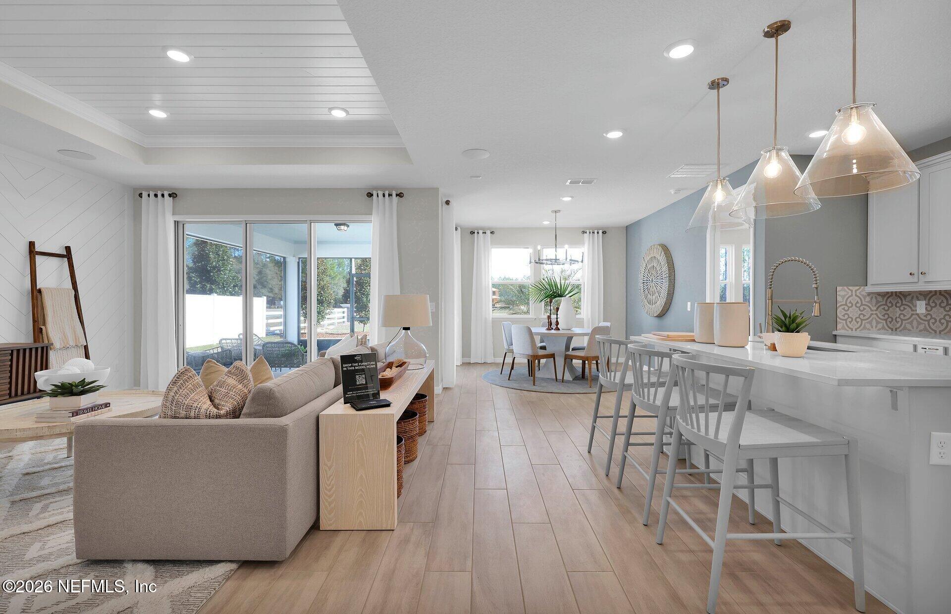 908 Rooster Hollow Way Middleburg, FL 32068 - Photo 9 of 26 a living room with furniture and a large window