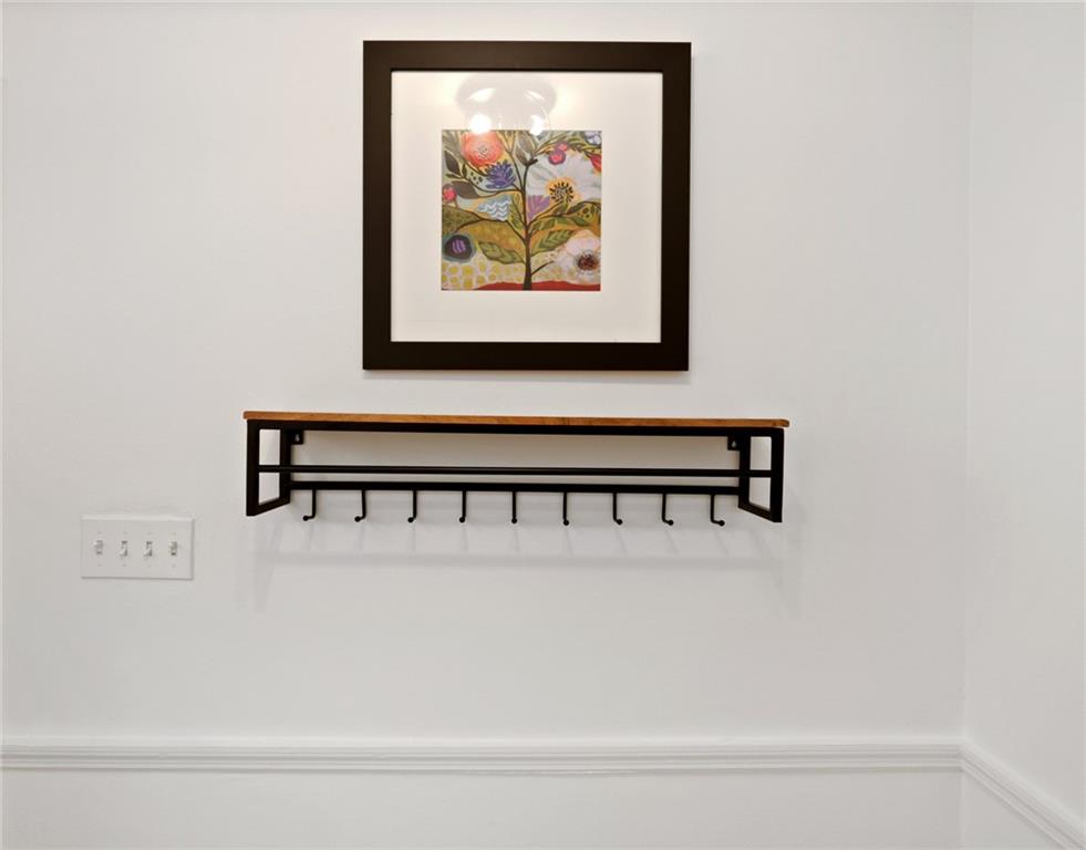 961 East Rock Springs Road Northeast, Unit MODERN Atlanta, GA 30306 - Photo 20 of 47 a view of a hallway with paintings on the wall