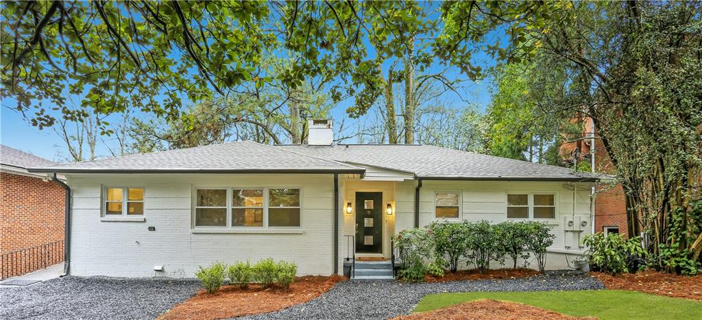 961 East Rock Springs Road Northeast, Unit MODERN Atlanta, GA 30306 - Photo 2 of 47 a front view of a house with garden