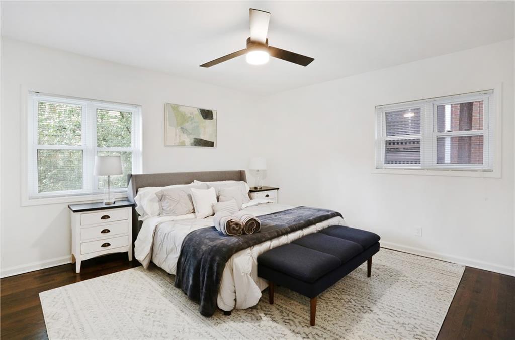 961 East Rock Springs Road Northeast, Unit MODERN Atlanta, GA 30306 - Photo 22 of 47 a bedroom with a bed lamp and a window