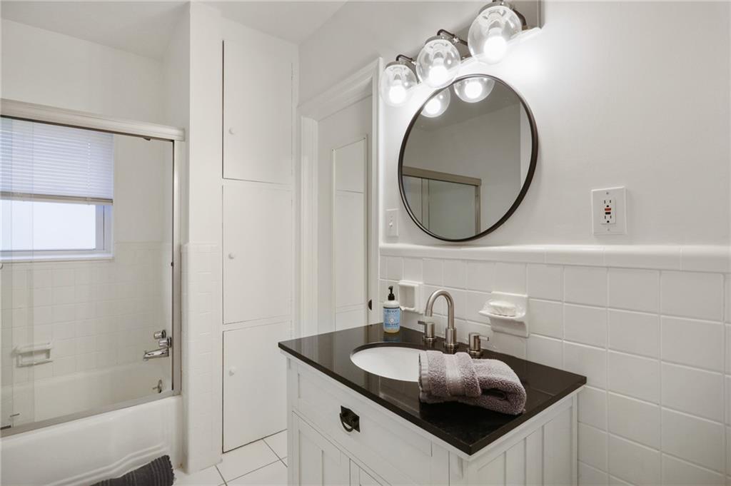961 East Rock Springs Road Northeast, Unit MODERN Atlanta, GA 30306 - Photo 30 of 47 a bathroom with a sink and a mirror