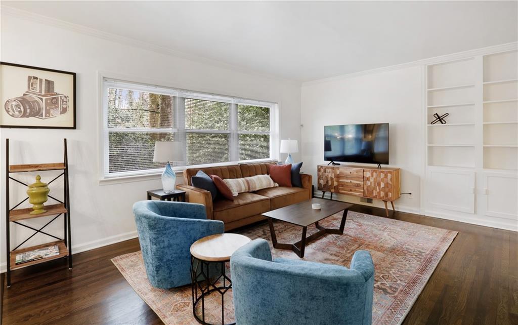961 East Rock Springs Road Northeast, Unit MODERN Atlanta, GA 30306 - Photo 3 of 47 a living room with furniture and a flat screen tv