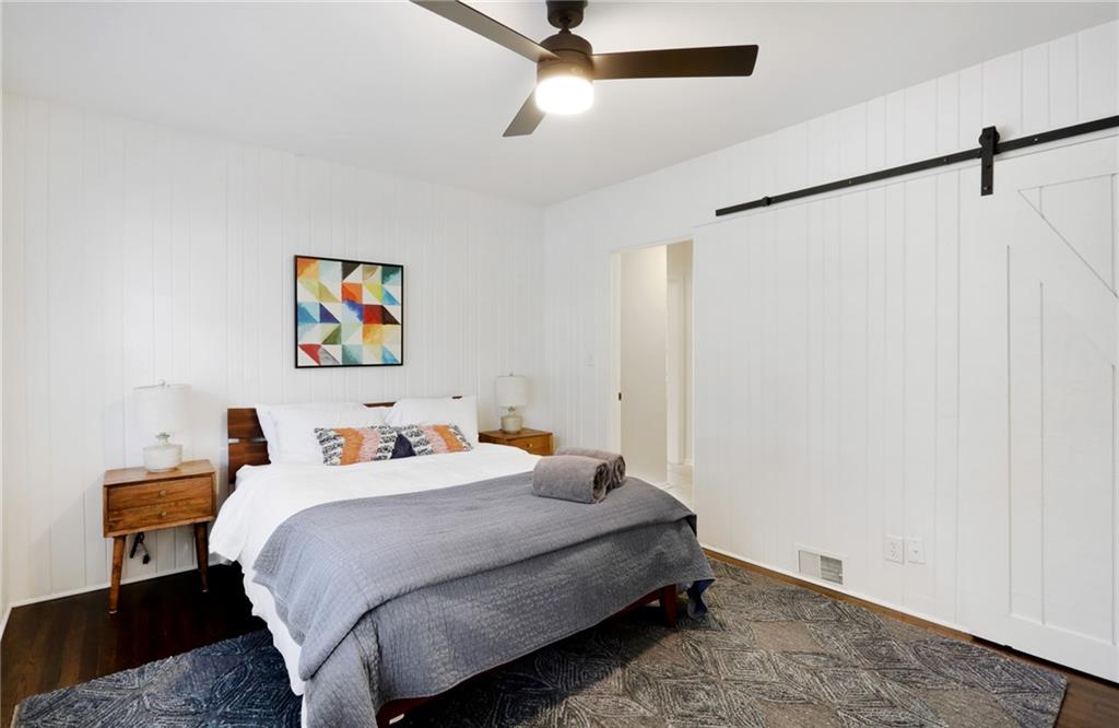 961 East Rock Springs Road Northeast, Unit MODERN Atlanta, GA 30306 - Photo 33 of 47 a bedroom with a bed and a painting on the wall