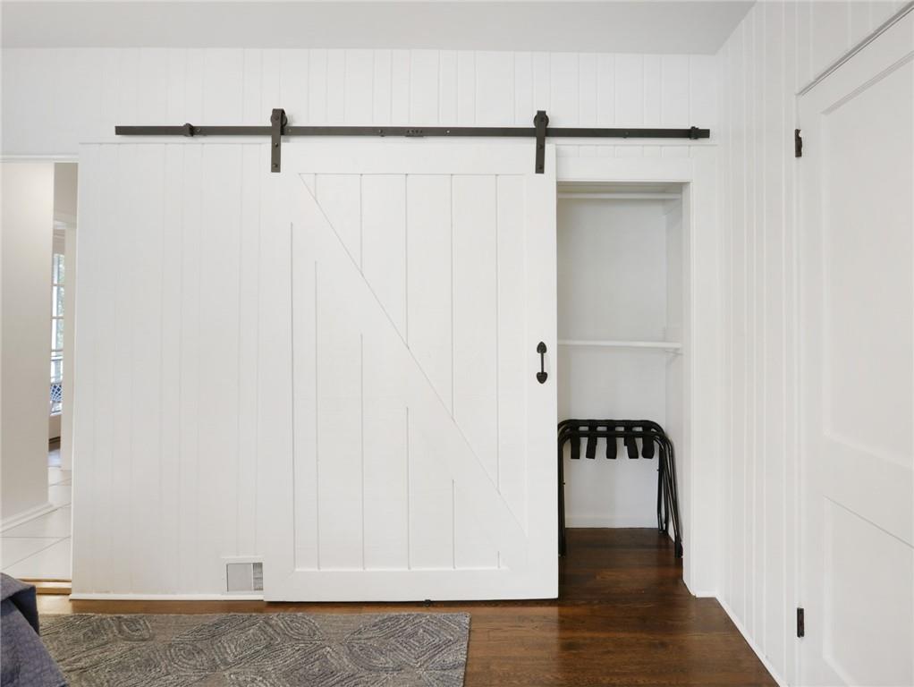 961 East Rock Springs Road Northeast, Unit MODERN Atlanta, GA 30306 - Photo 34 of 47 a view of walk in closet with clothes