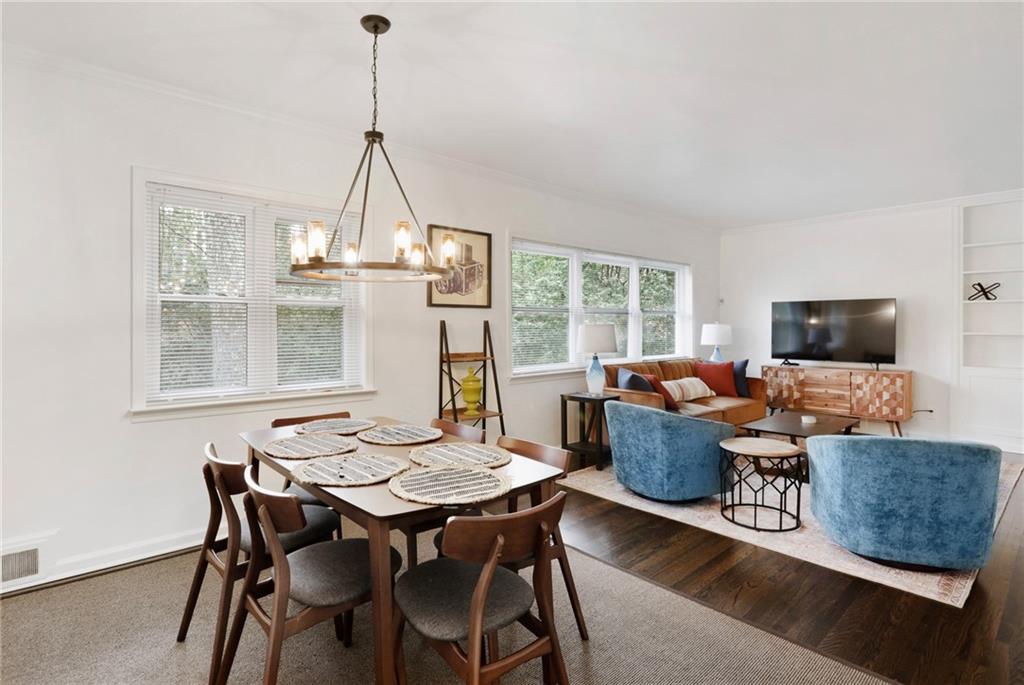 961 East Rock Springs Road Northeast, Unit MODERN Atlanta, GA 30306 - Photo 8 of 47 a living room with furniture a flat screen tv and a window