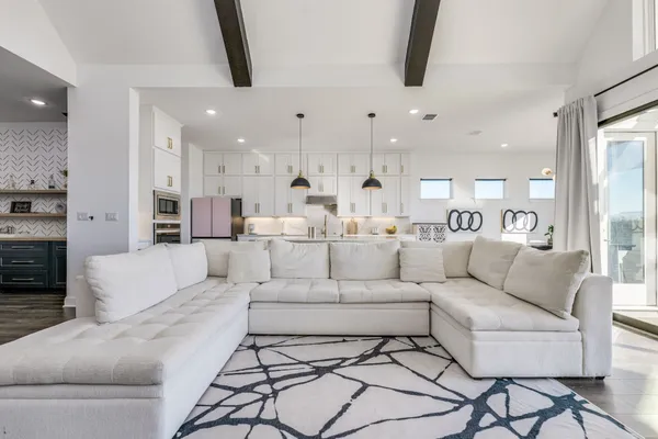 a living room with furniture white walls and white walls