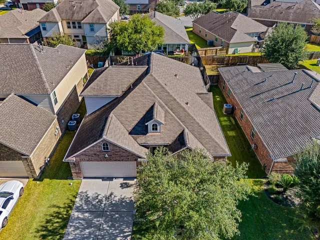 an aerial view of a house with a garden