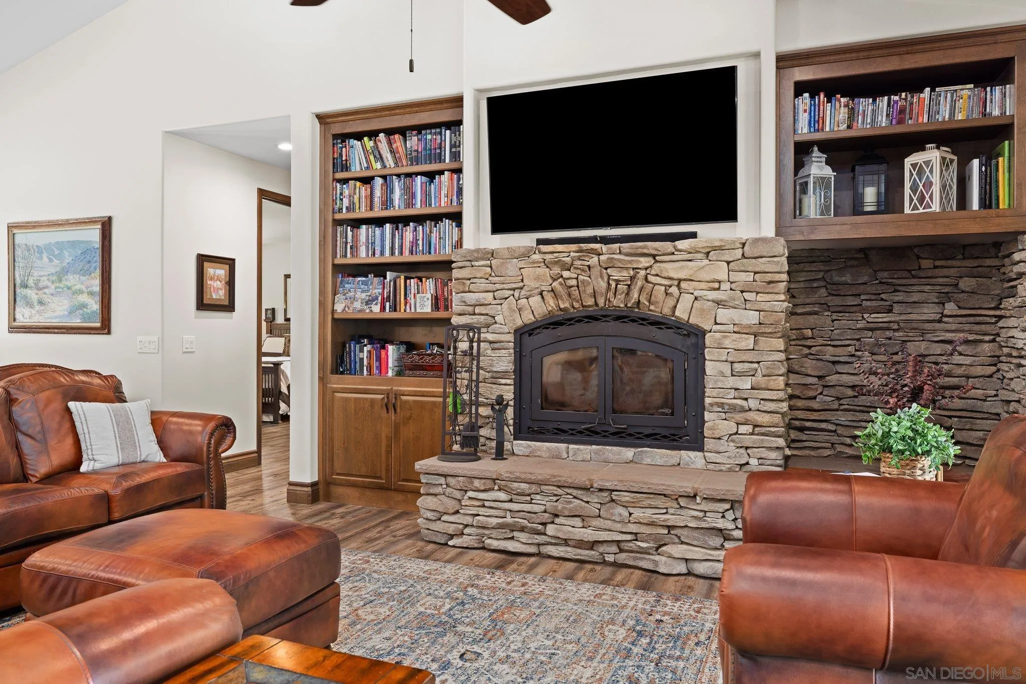 19553 Hidden Glen Road Alpine, CA 91901 - Photo 16 of 55 a living room with furniture fireplace and a flat screen tv