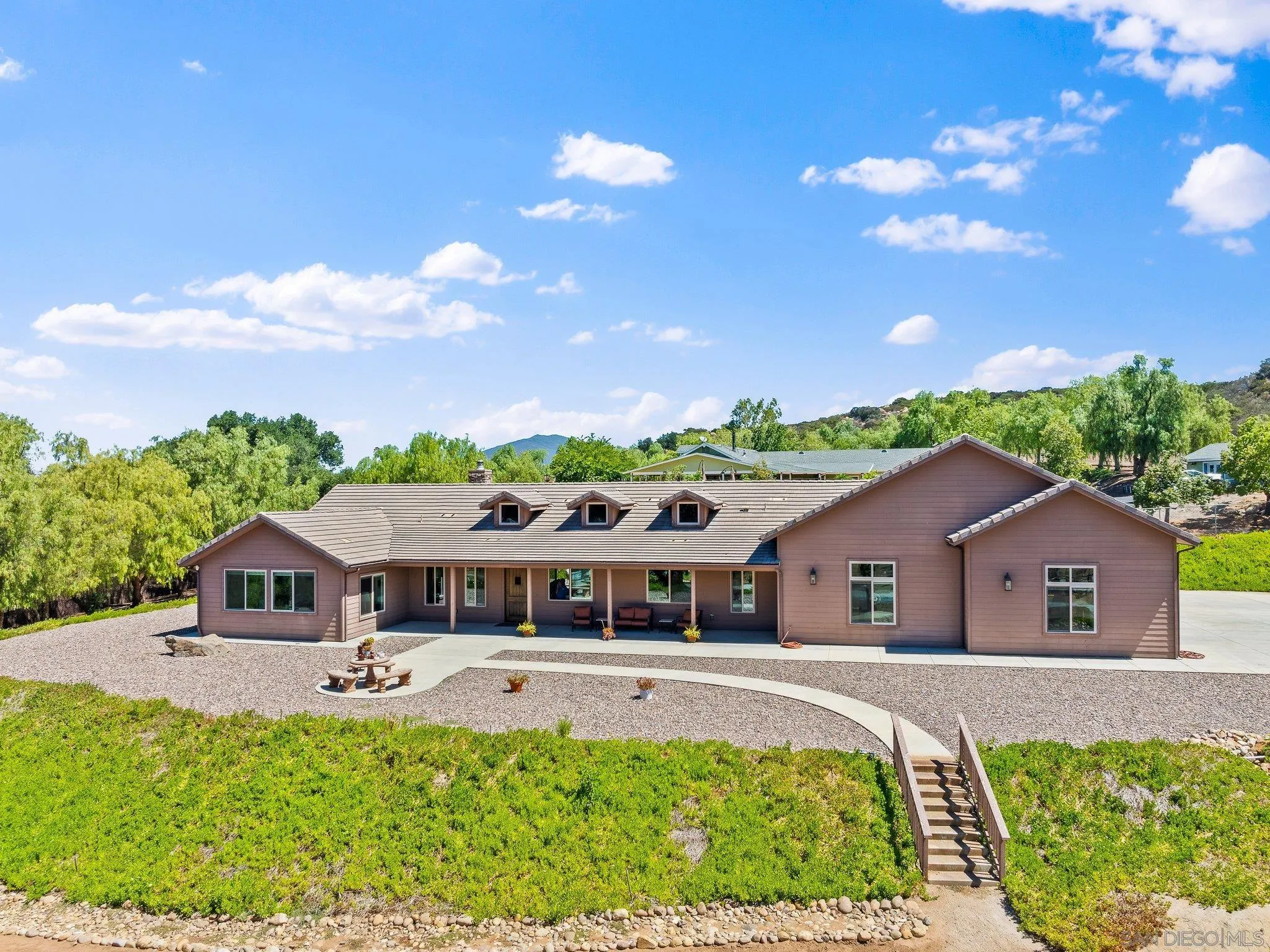 19553 Hidden Glen Road Alpine, CA 91901 - Photo 2 of 55 a front view of a house with a yard