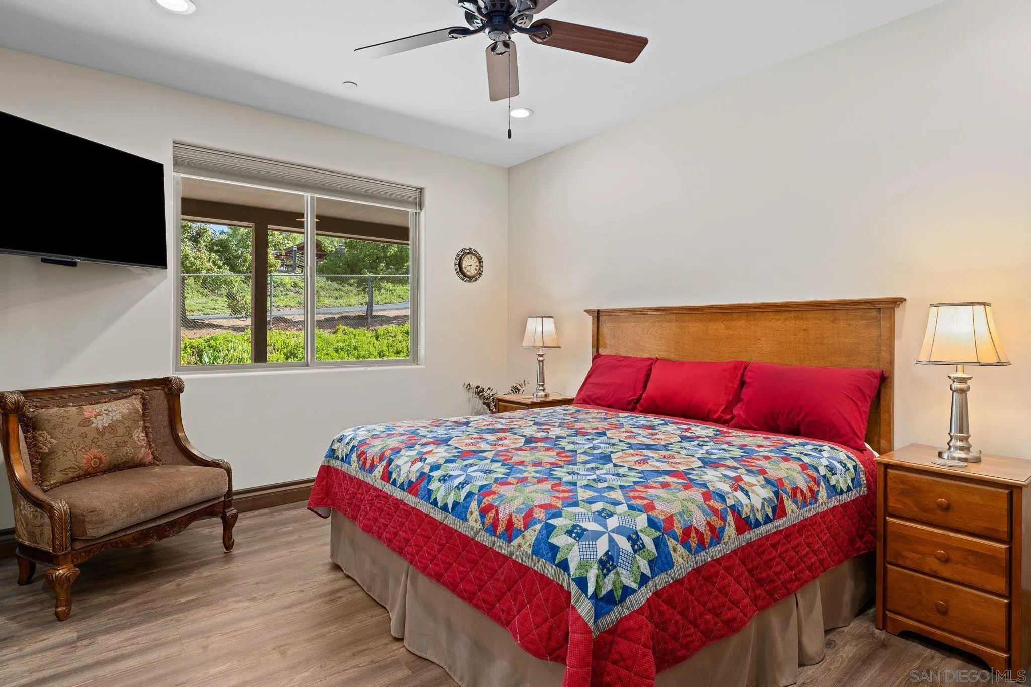 19553 Hidden Glen Road Alpine, CA 91901 - Photo 27 of 55 a bedroom with a bed a couch and a window