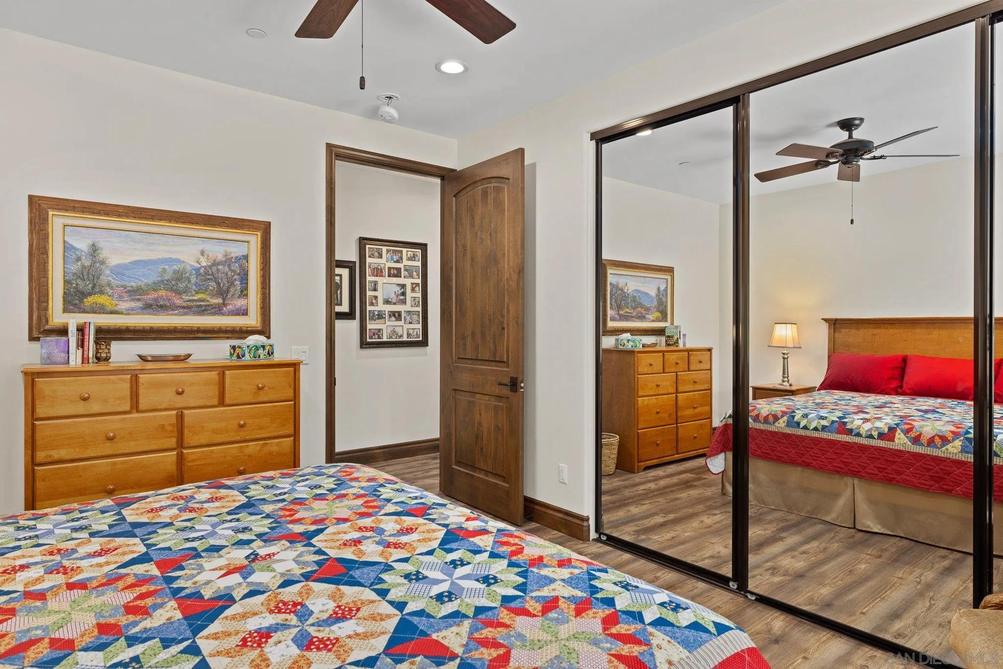 19553 Hidden Glen Road Alpine, CA 91901 - Photo 28 of 55 a bedroom with a bed and a dresser in it