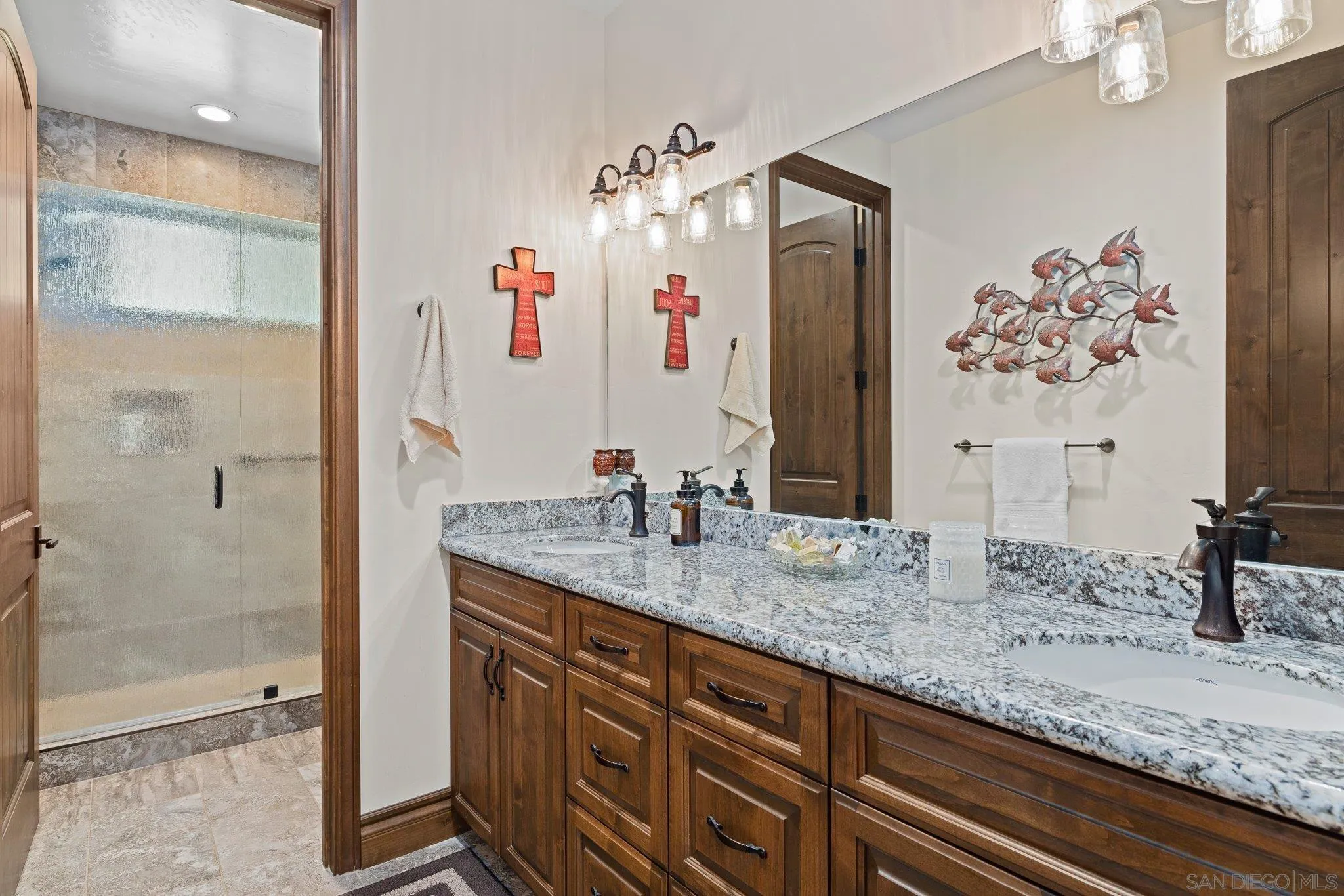 19553 Hidden Glen Road Alpine, CA 91901 - Photo 29 of 55 a bathroom with a granite countertop sink and a mirror
