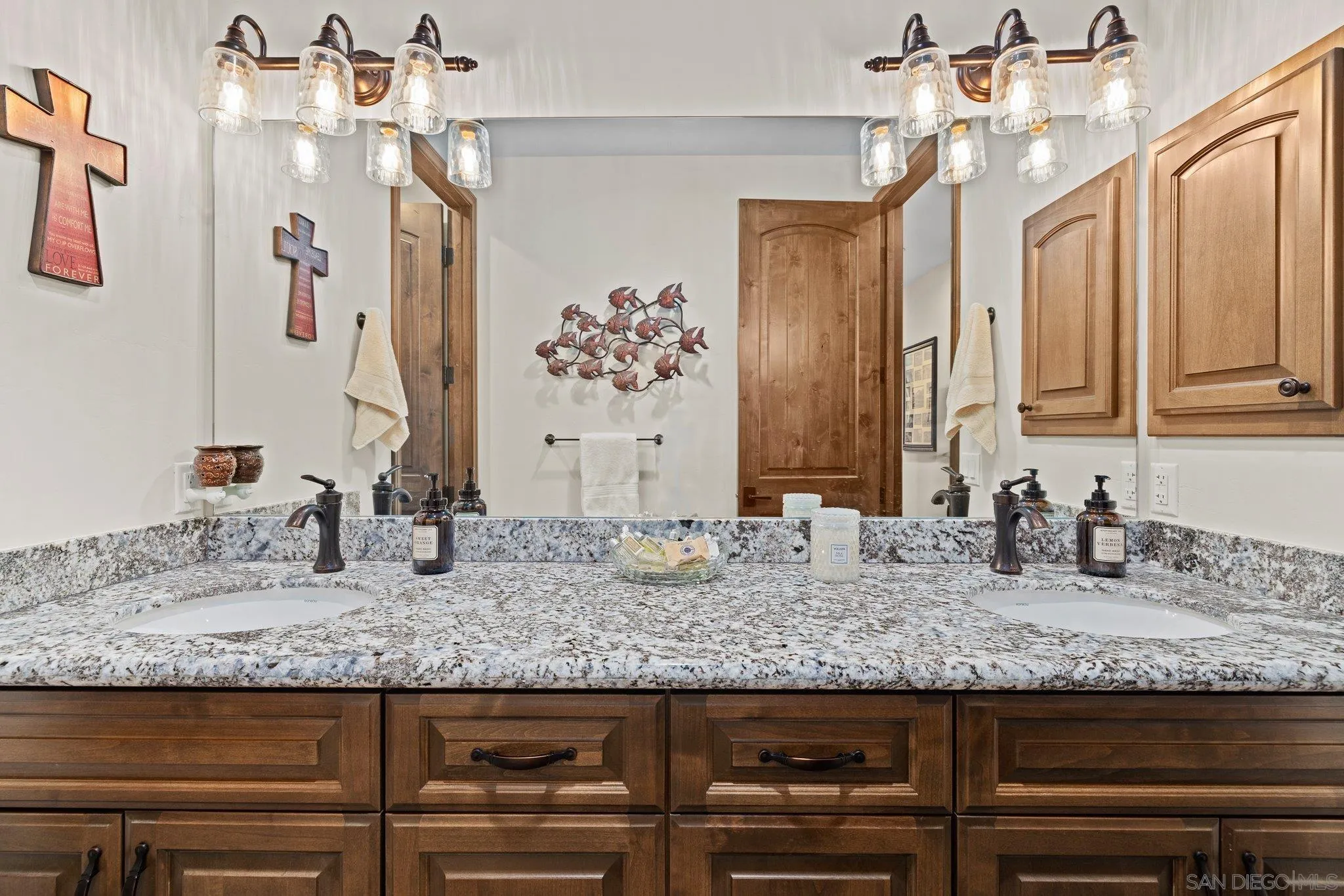 19553 Hidden Glen Road Alpine, CA 91901 - Photo 31 of 55 a bathroom with granite countertop a sink and a wooden floor