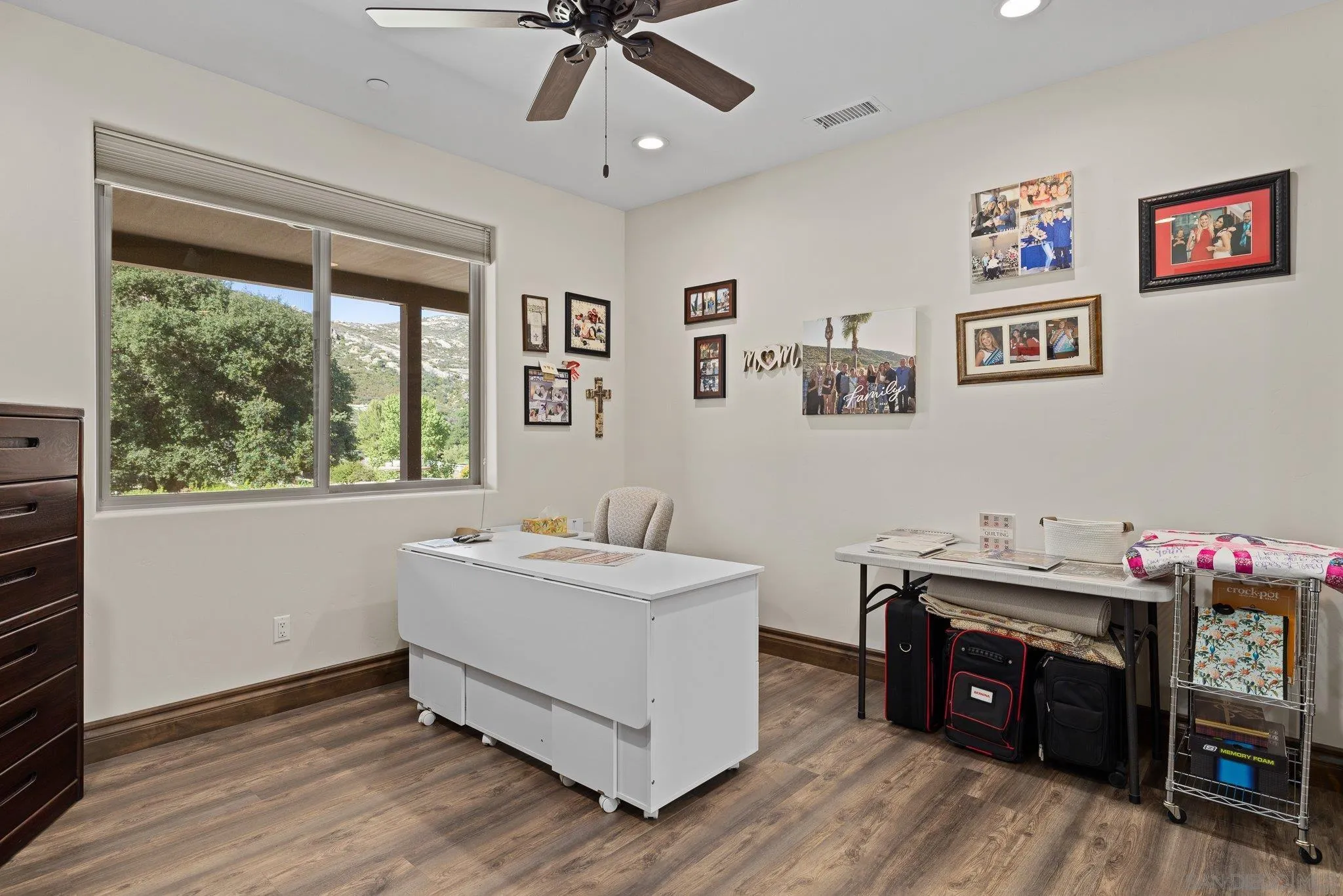 19553 Hidden Glen Road Alpine, CA 91901 - Photo 32 of 55 a view of a workspace with furniture and a window