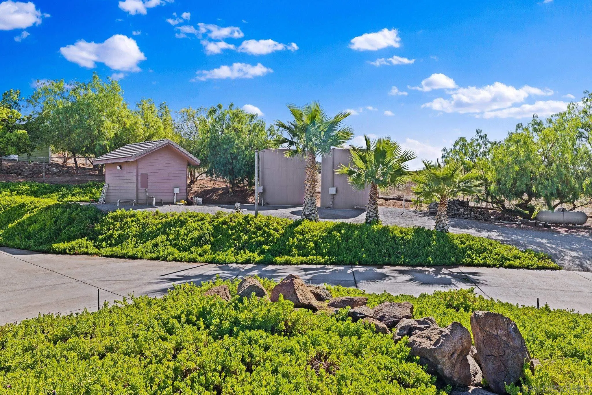 19553 Hidden Glen Road Alpine, CA 91901 - Photo 43 of 55 a view of a house with a yard and garden in a patio