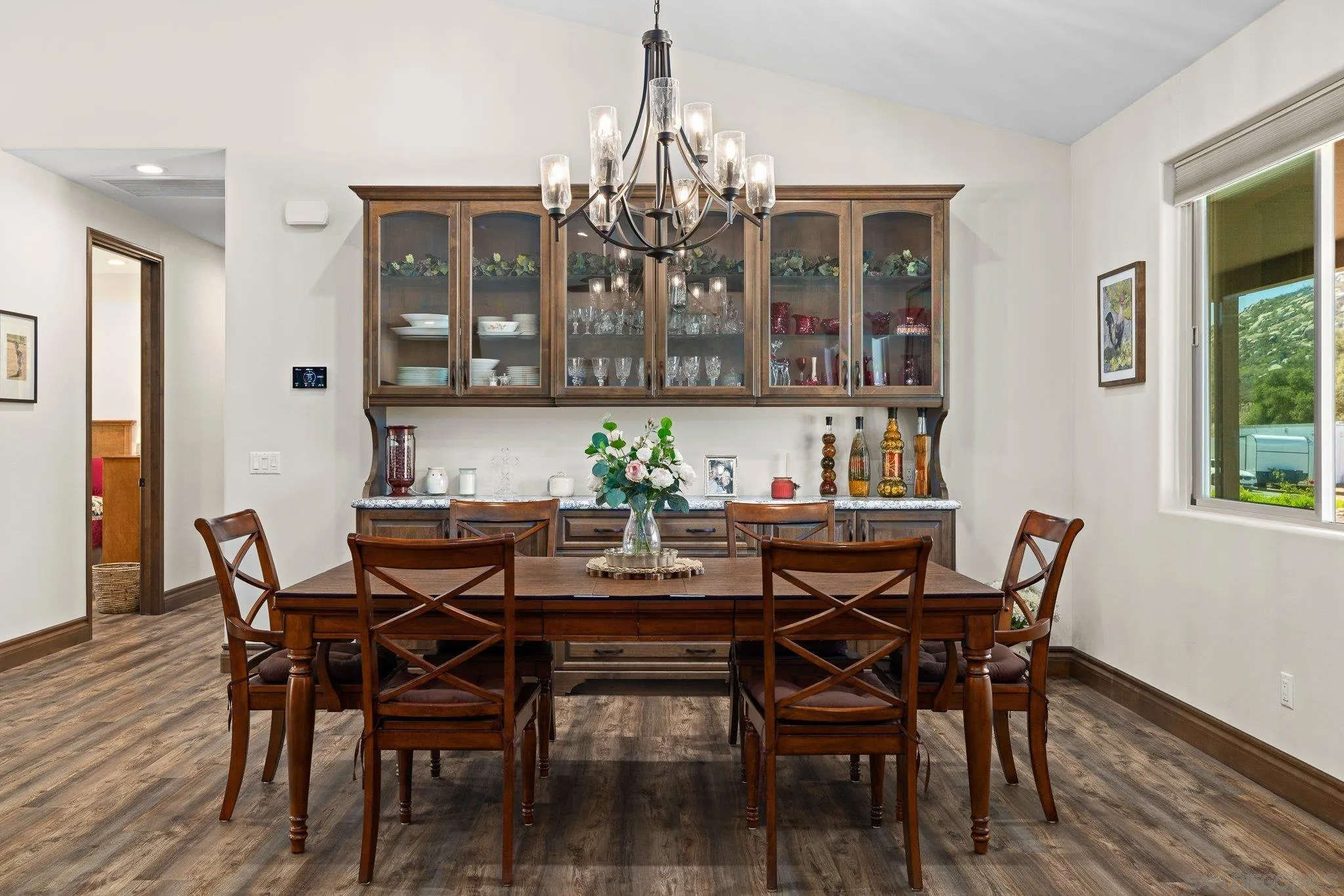 19553 Hidden Glen Road Alpine, CA 91901 - Photo 8 of 55 a view of a dining room with furniture and wooden floor