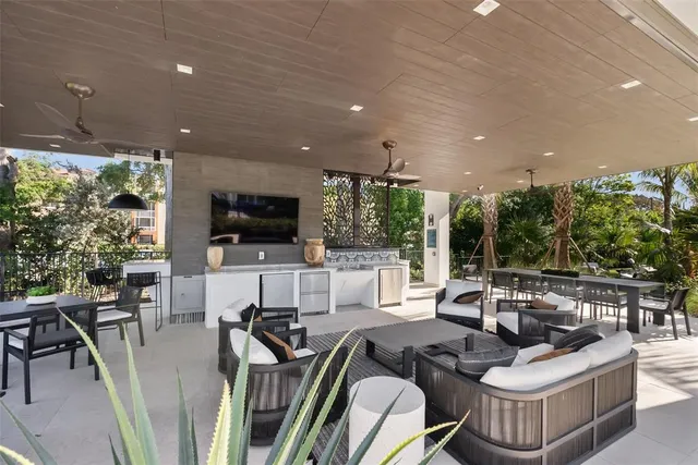 a living room with lots of furniture and a flat screen tv