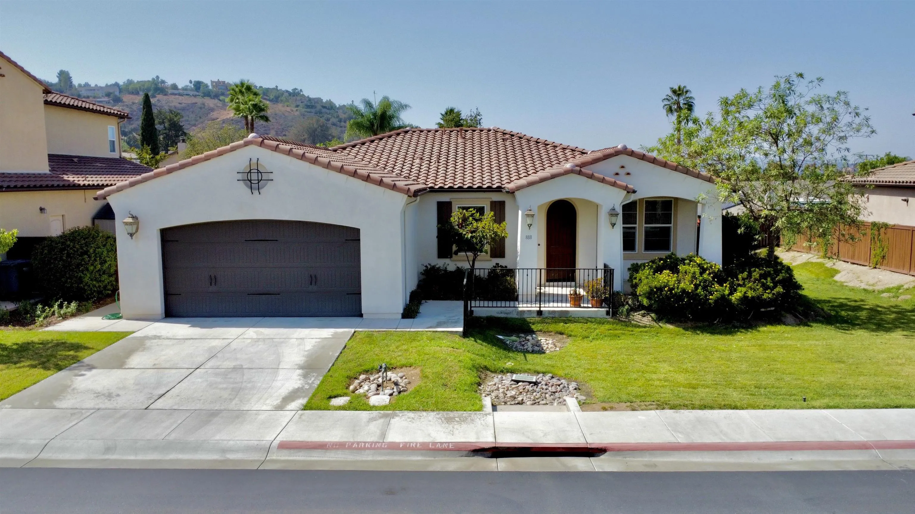 a view of house with swimming pool and green space