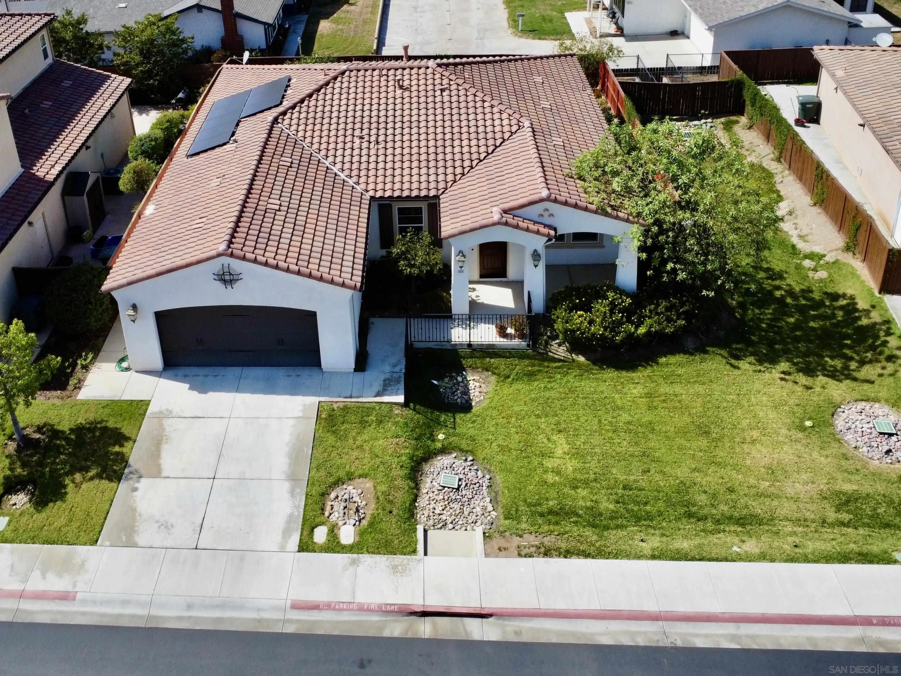 888 Rancho Terrace Ct. El Cajon, CA 92019 - Photo 2 of 34 a front view of a house with garden