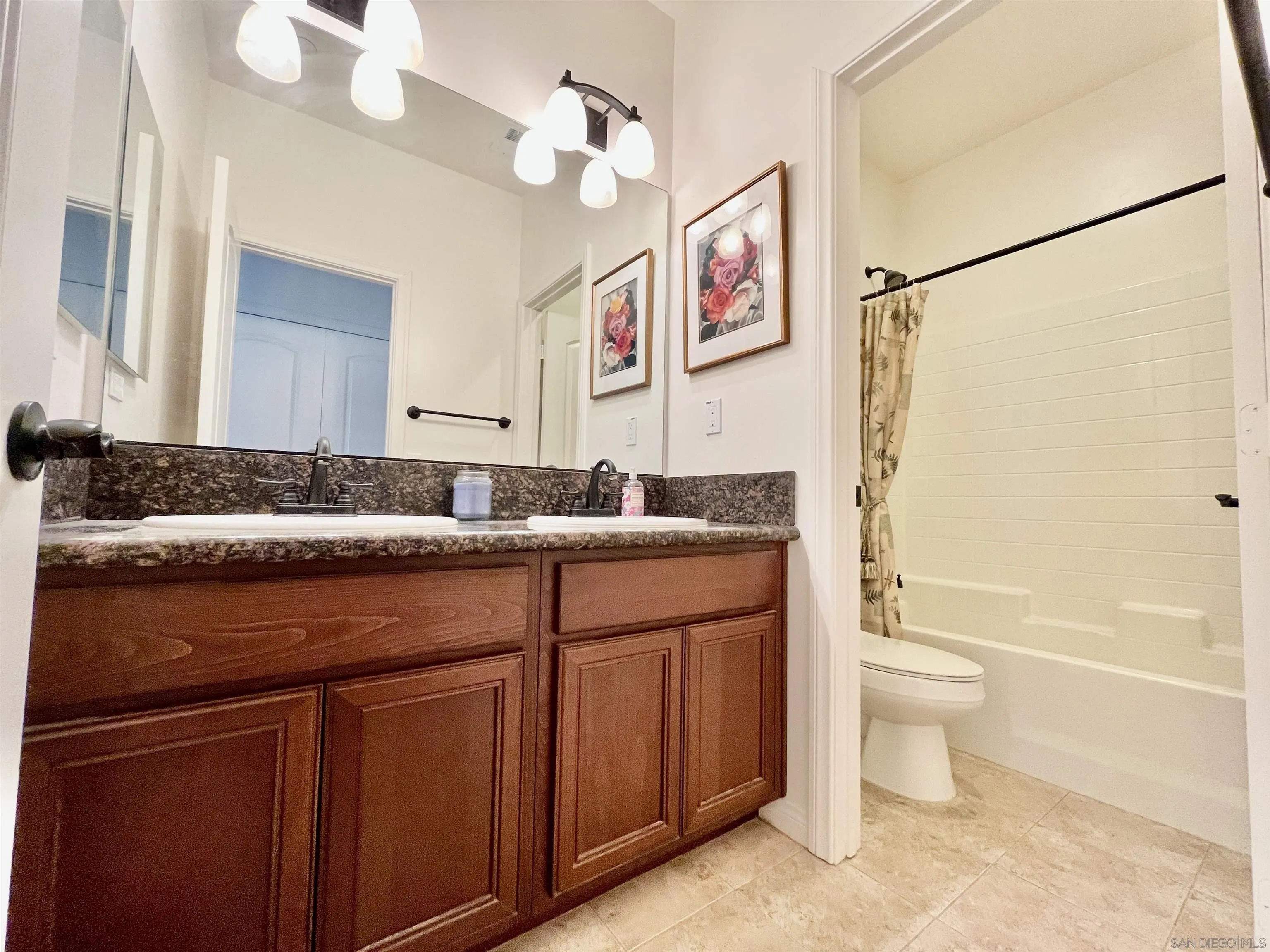 888 Rancho Terrace Ct. El Cajon, CA 92019 - Photo 21 of 34 a bathroom with a granite countertop sink a toilet and bathtub