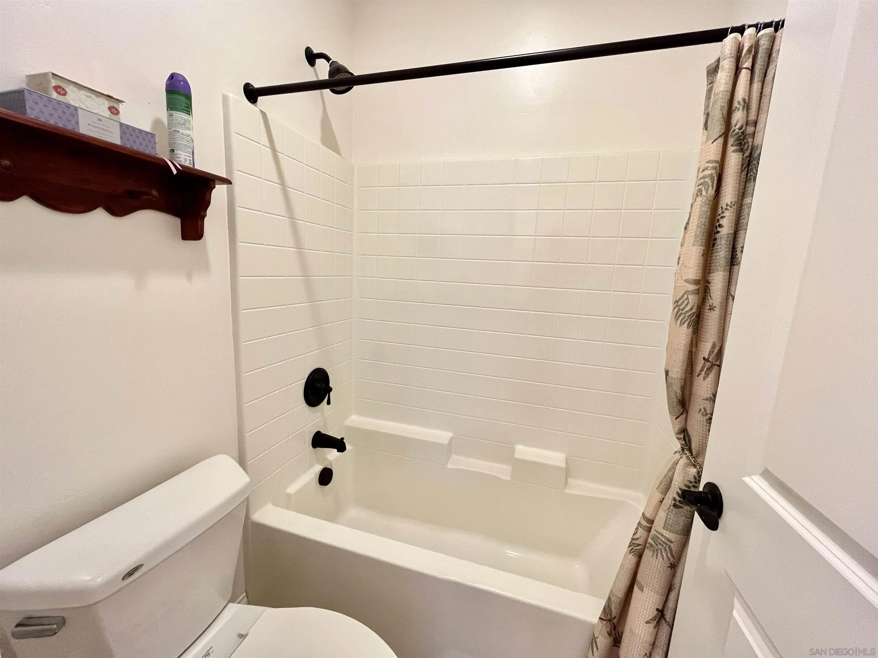 888 Rancho Terrace Ct. El Cajon, CA 92019 - Photo 22 of 34 a bathroom with a shower a toilet and a tub