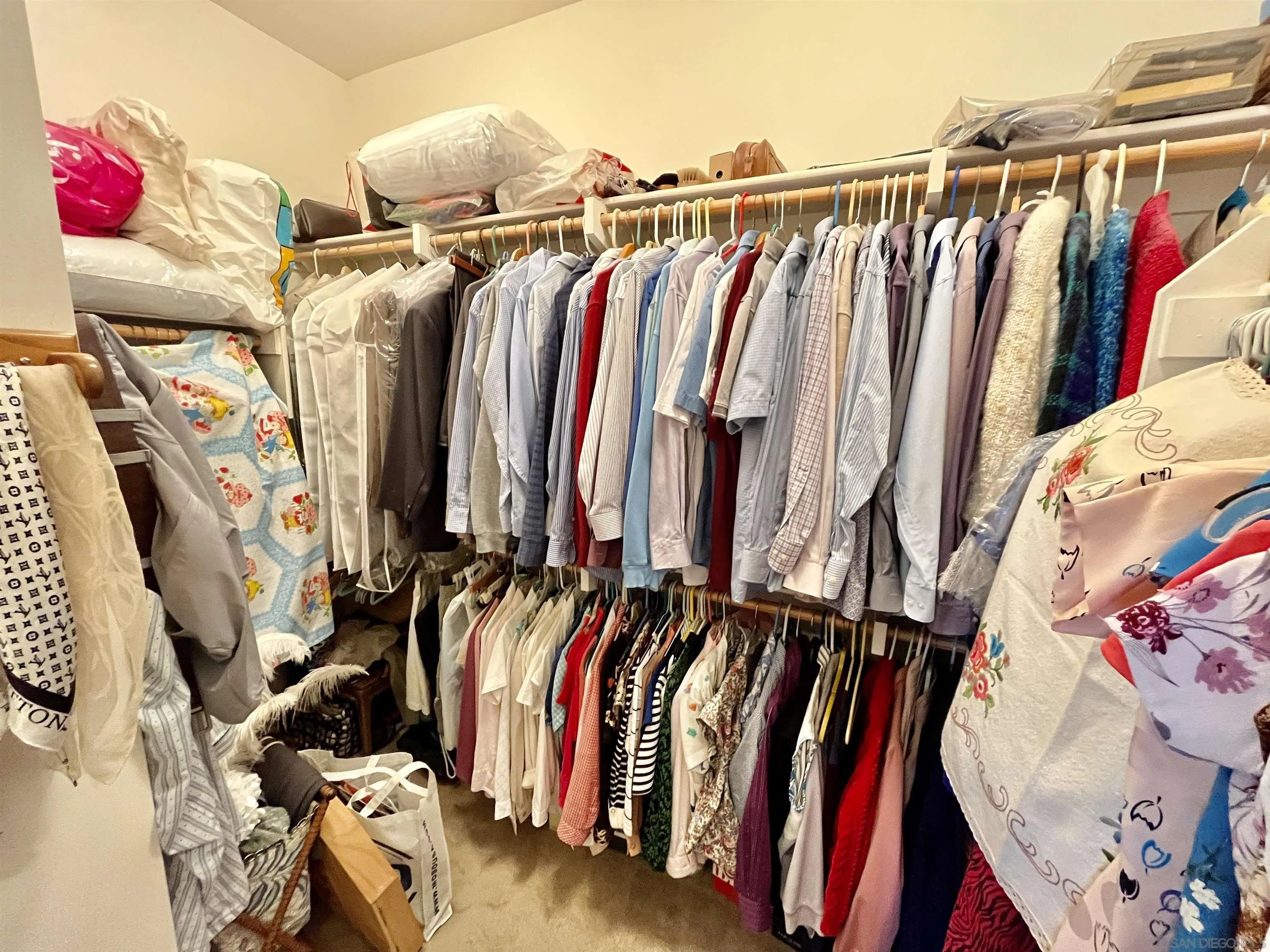 888 Rancho Terrace Ct. El Cajon, CA 92019 - Photo 26 of 34 a view of walk in closet with clothes and shoes