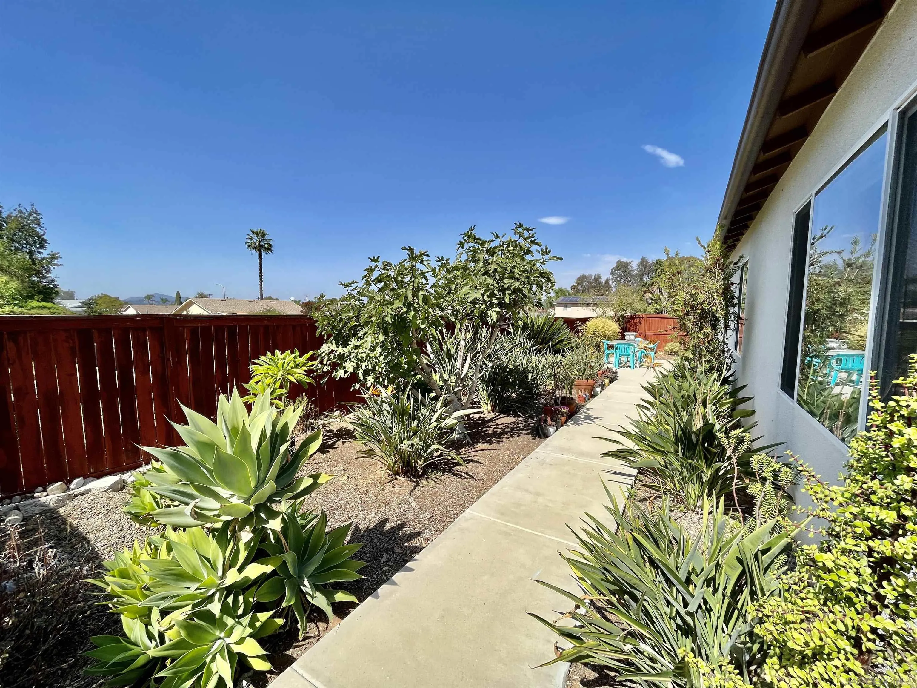 888 Rancho Terrace Ct. El Cajon, CA 92019 - Photo 32 of 34 a view of a backyard with plants