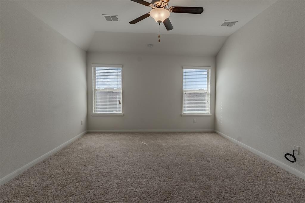 240 Copper Switch Drive Anna, TX 75409 - Photo 11 of 33 Spare room featuring ceiling fan, light carpet, and lofted ceiling