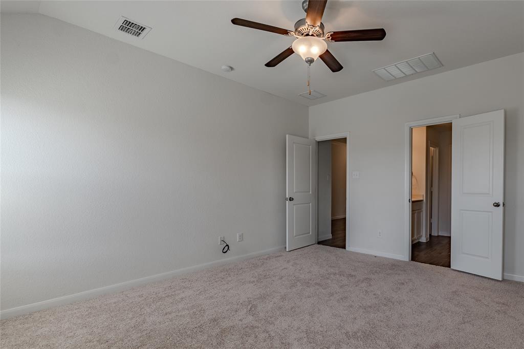 240 Copper Switch Drive Anna, TX 75409 - Photo 14 of 33 Unfurnished bedroom featuring dark colored carpet and a ceiling fan