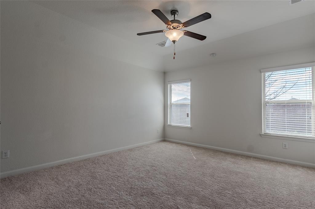 240 Copper Switch Drive Anna, TX 75409 - Photo 15 of 33 Empty room featuring light colored carpet and ceiling fan