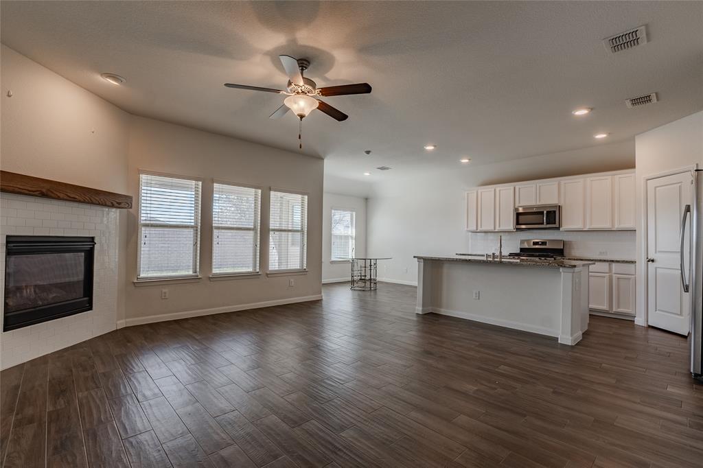 240 Copper Switch Drive Anna, TX 75409 - Photo 31 of 33 Kitchen with open floor plan, a ceiling fan, white cabinets, dark wood-type flooring, and recessed lighting