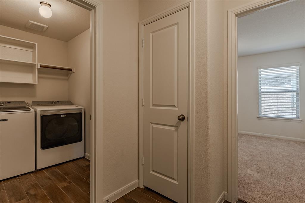 240 Copper Switch Drive Anna, TX 75409 - Photo 28 of 33 Washroom with independent washer and dryer and dark wood finished floors
