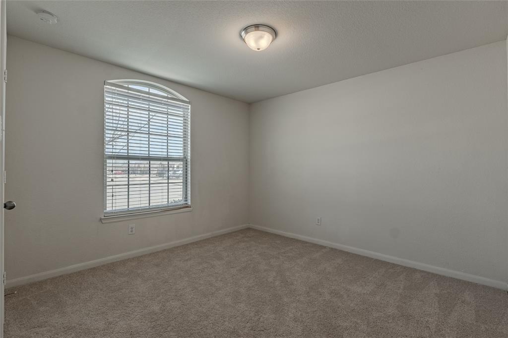240 Copper Switch Drive Anna, TX 75409 - Photo 6 of 33 Empty room featuring carpet and baseboards