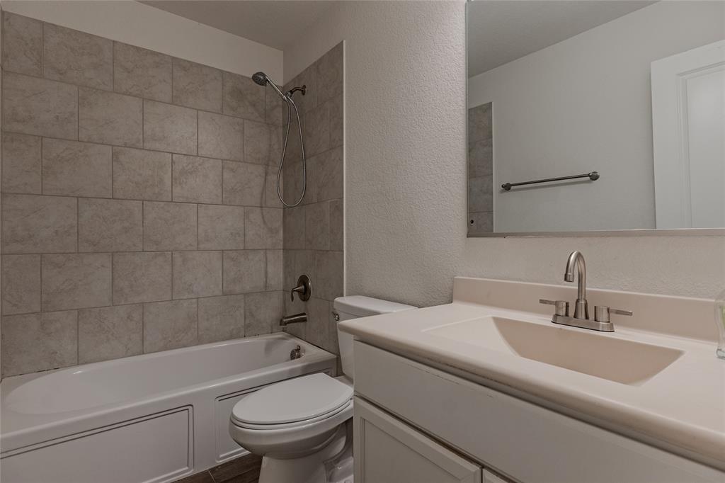 240 Copper Switch Drive Anna, TX 75409 - Photo 8 of 33 Bathroom featuring vanity, shower / tub combination, and a textured wall