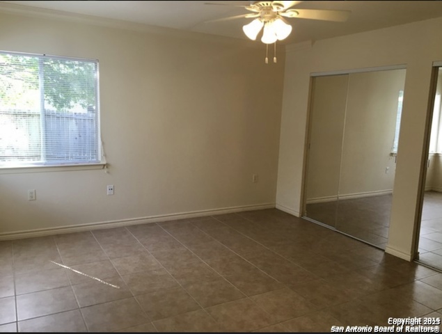 16619 Crested Butte Street San Antonio, TX 78247 - Photo 4 of 5 an empty room with a window