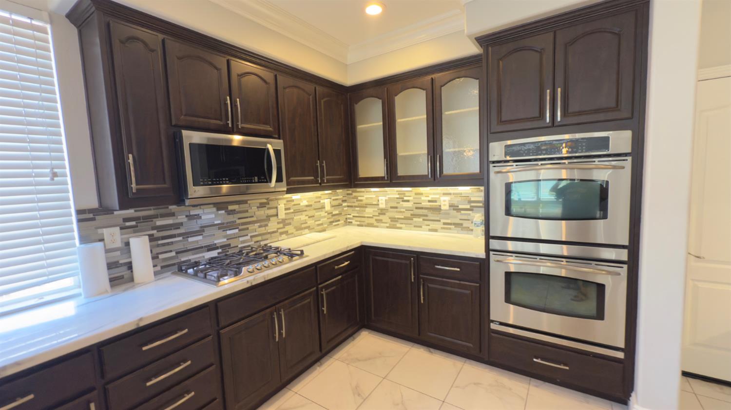 11816 Spring Walk Way Rancho Cordova, CA 95742 - Photo 13 of 36 a kitchen with granite countertop cabinets stainless steel appliances and a counter space