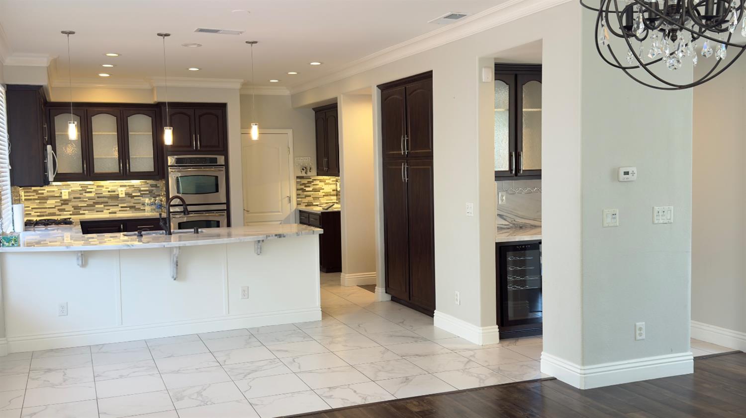 11816 Spring Walk Way Rancho Cordova, CA 95742 - Photo 14 of 36 a open kitchen with stainless steel appliances granite countertop a refrigerator and a sink